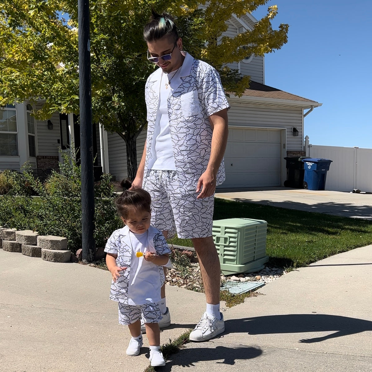 Father and child wearing matching Relaxed Clouds shirt-and-shorts outfits