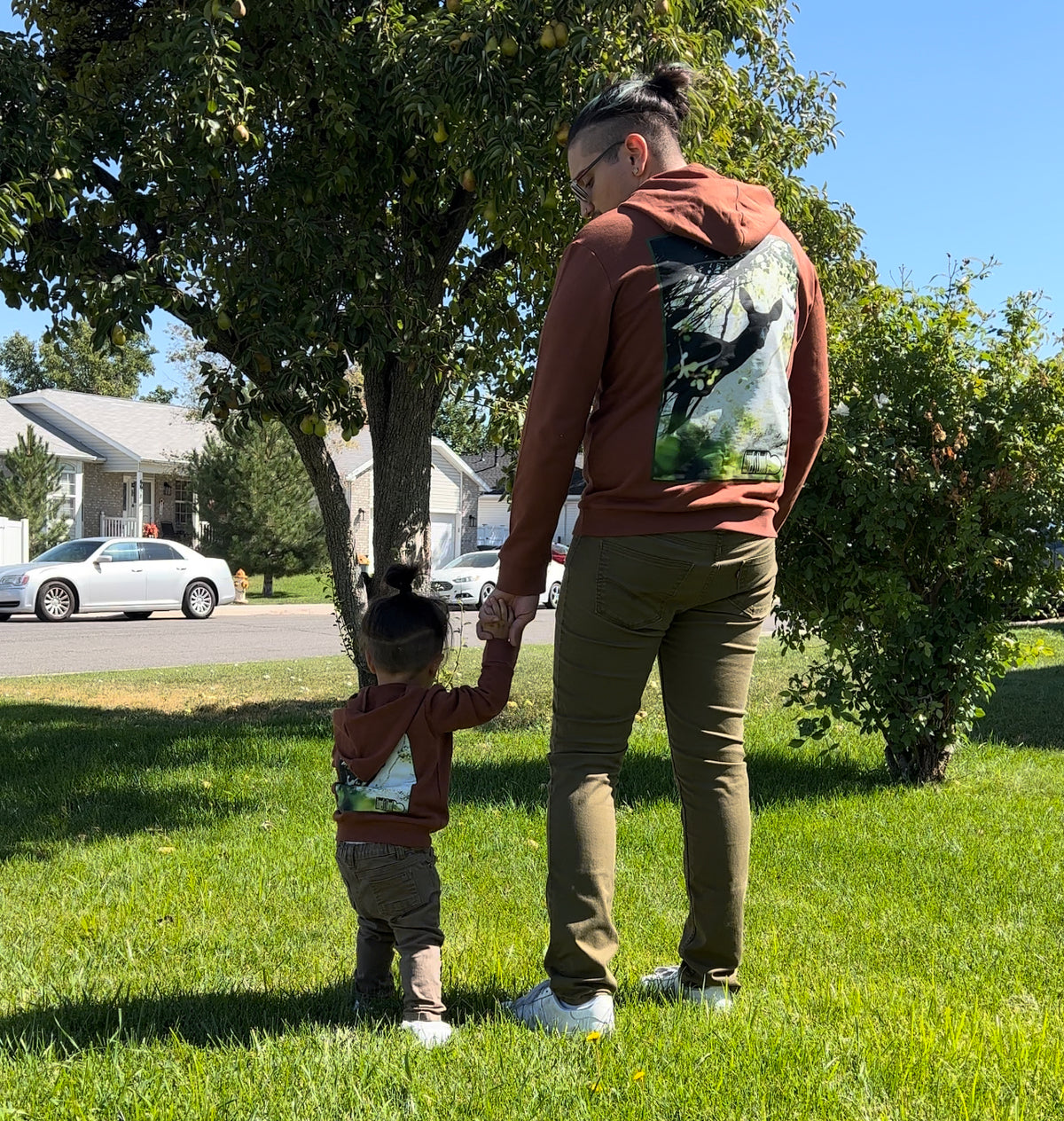 Father and child wearing matching Hunted Hoodies