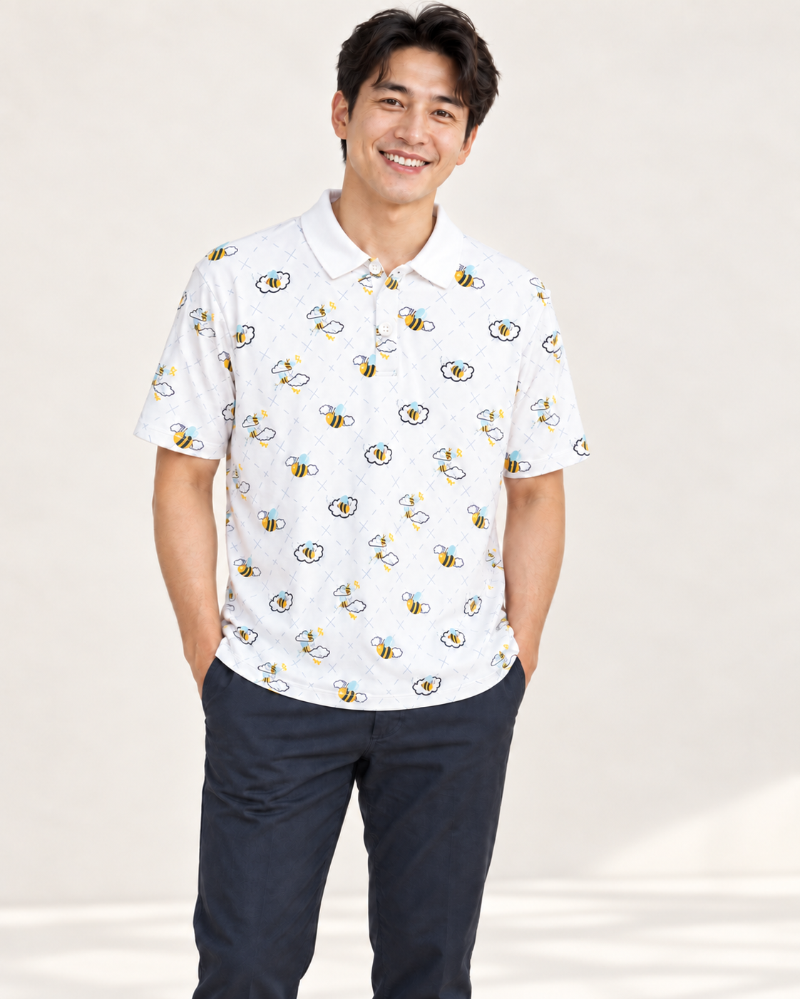 Father wearing a white Buzzed Polo with a bee-and-cloud print.