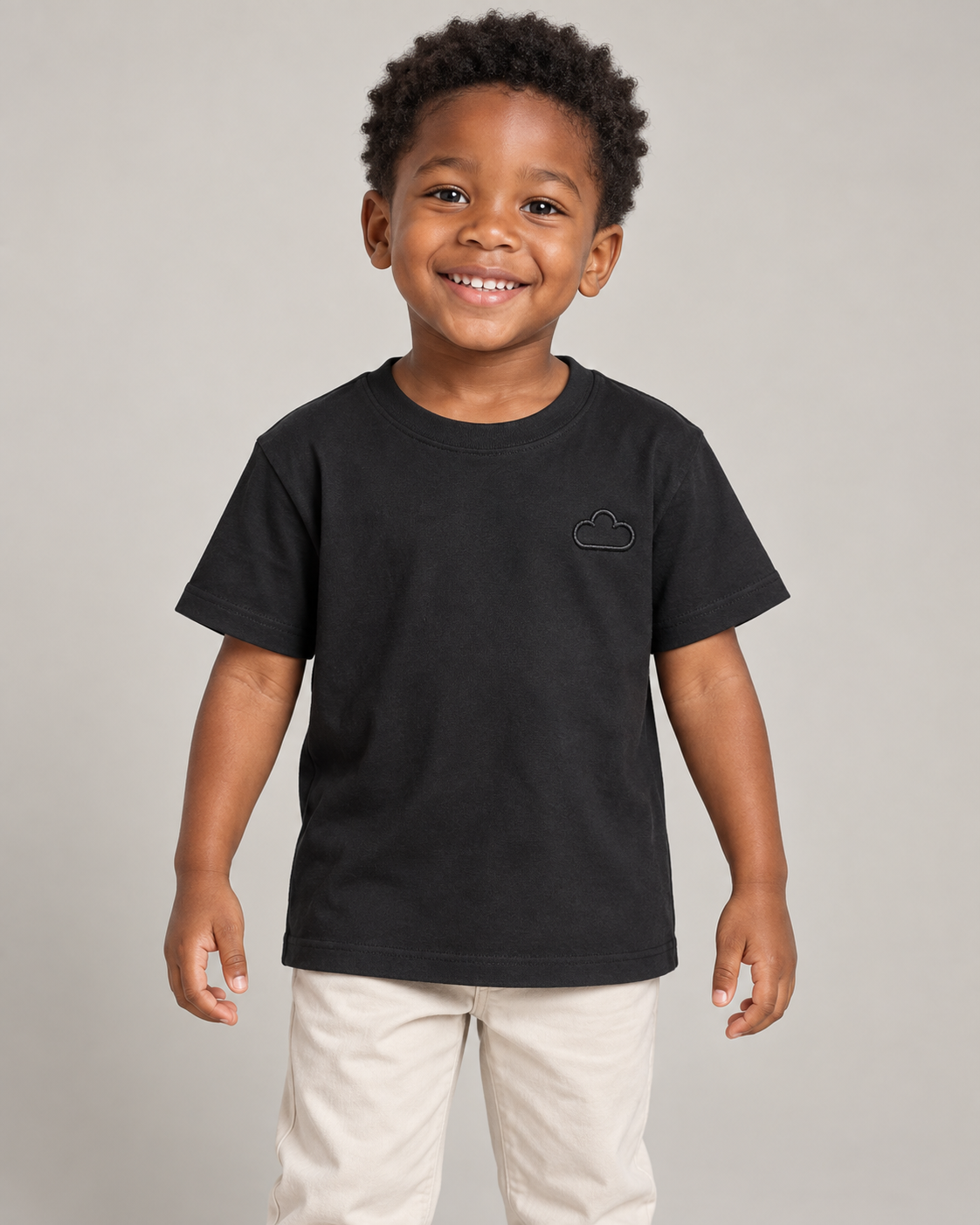 Child wearing a Midnight Classic Black Tee with a subtle cloud outline.