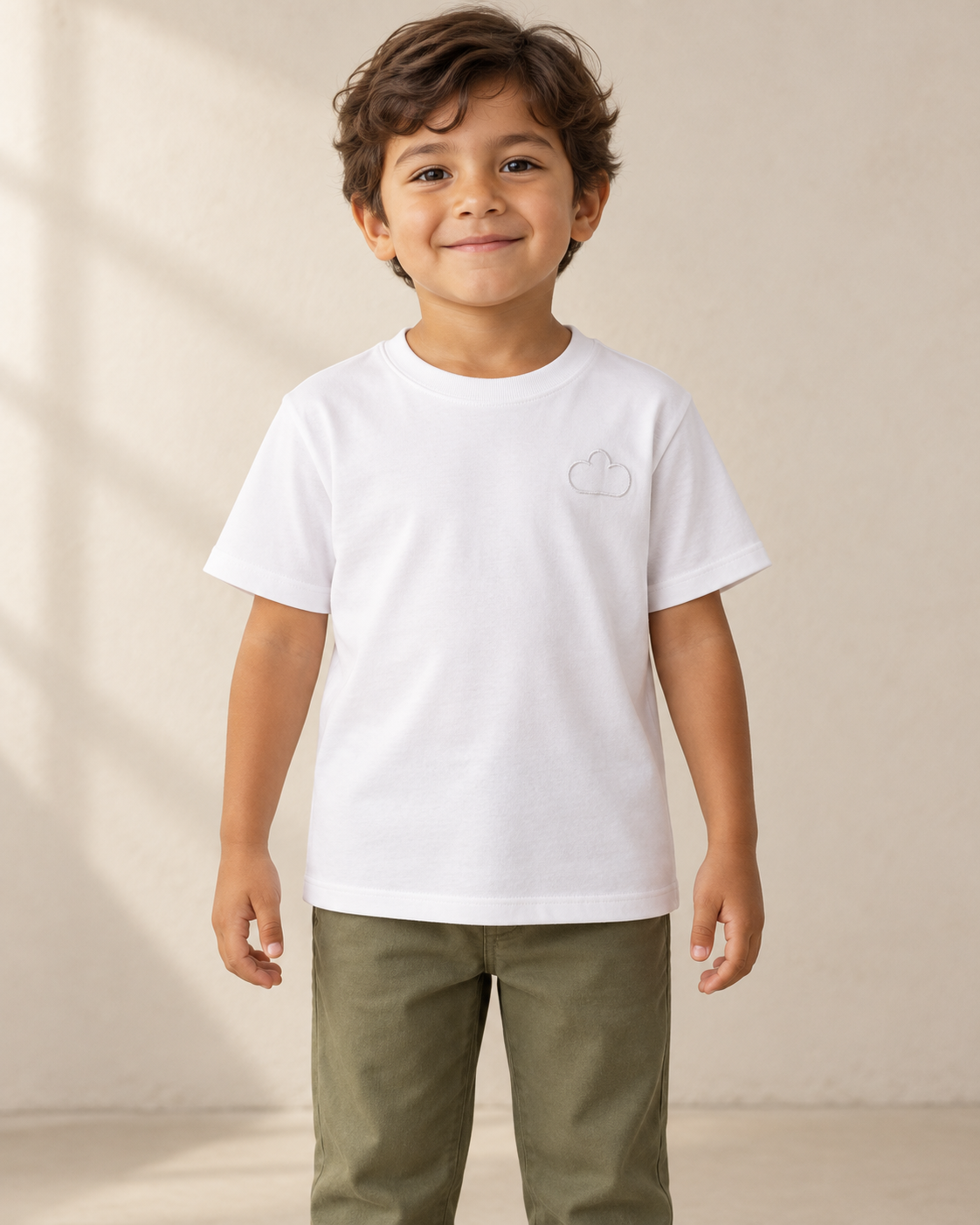AI-created child wearing a White Horizon Tee with a tonal cloud outline.